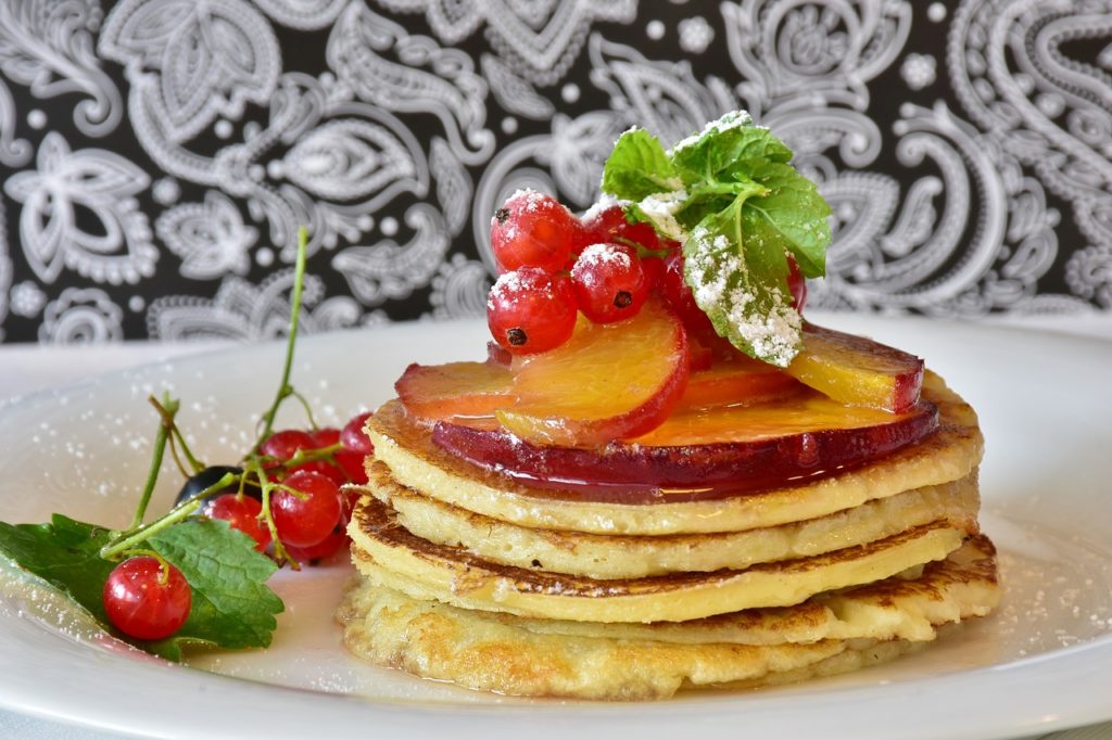 pancake, honey, fruits